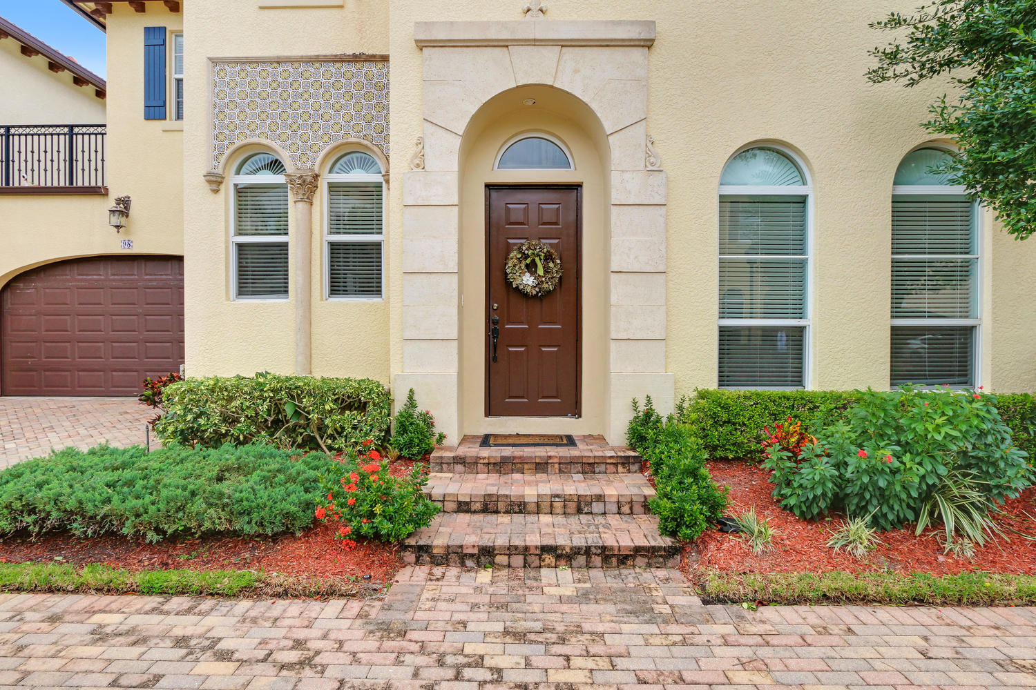 98 Via Poinciana Lane Boca Raton, FL 33487 - Photo 5 of 38 a front view of a house