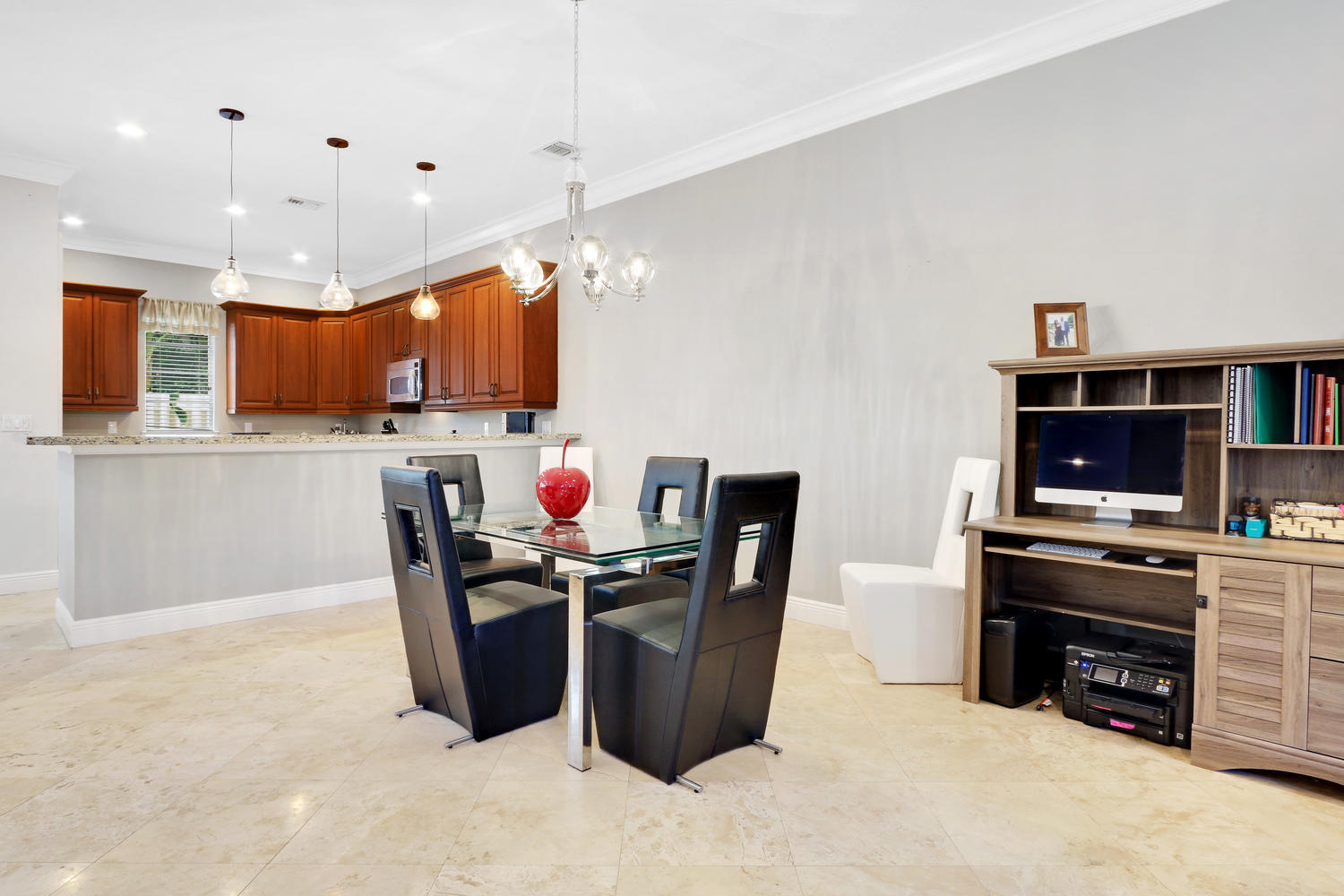 98 Via Poinciana Lane Boca Raton, FL 33487 - Photo 10 of 38 a kitchen with stainless steel appliances kitchen island granite countertop a refrigerator and a stove top oven