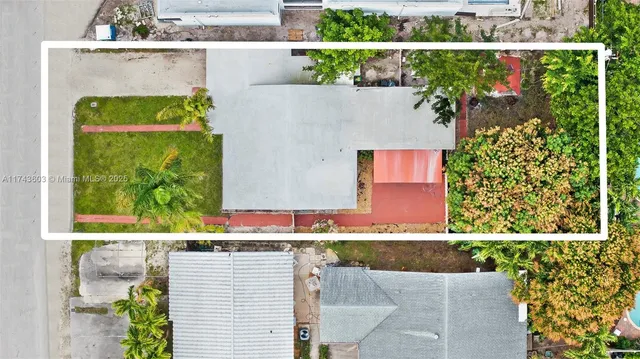 front view of a house with a garden