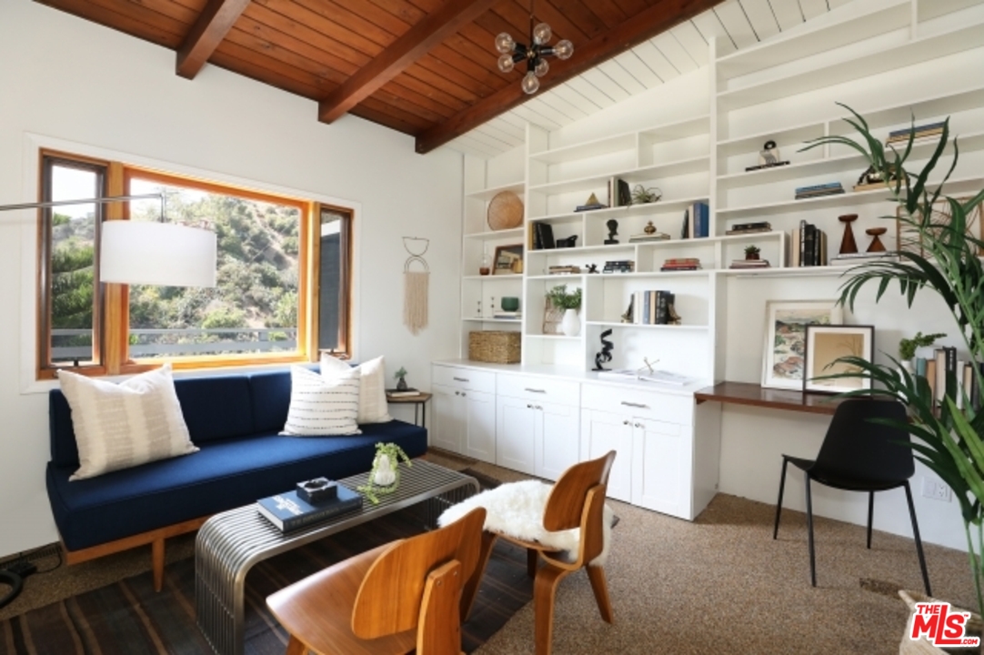 8400 Utica Drive Los Angeles, CA 90046 - Photo 12 of 32 a living room with furniture and a large window