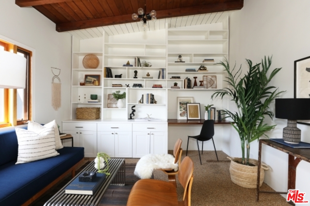8400 Utica Drive Los Angeles, CA 90046 - Photo 13 of 32 a living room with furniture cabinets and a potted plant