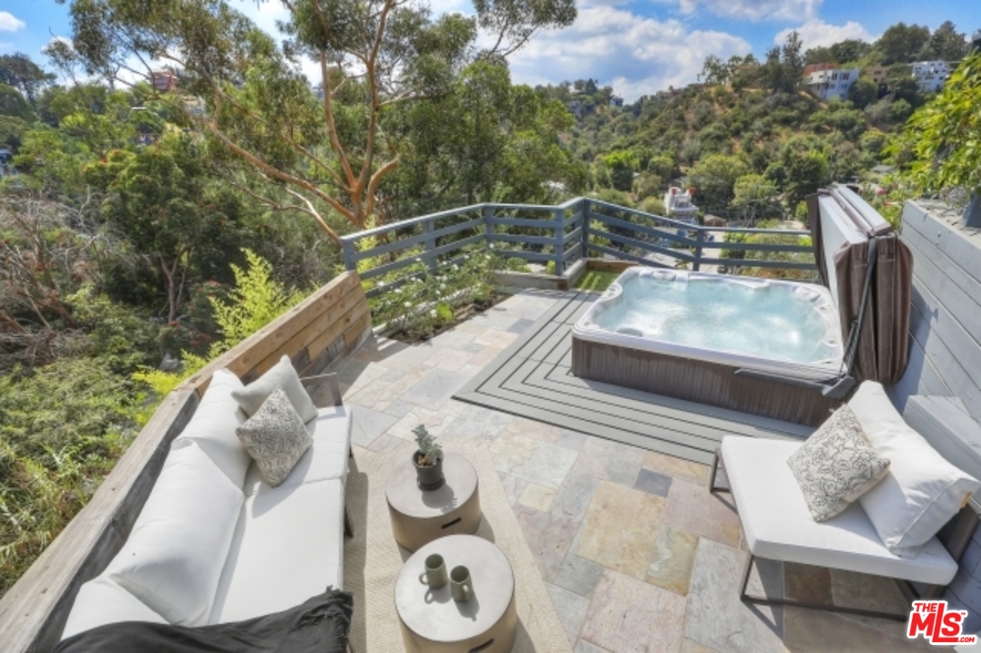 8400 Utica Drive Los Angeles, CA 90046 - Photo 23 of 32 a view of a yard with furniture