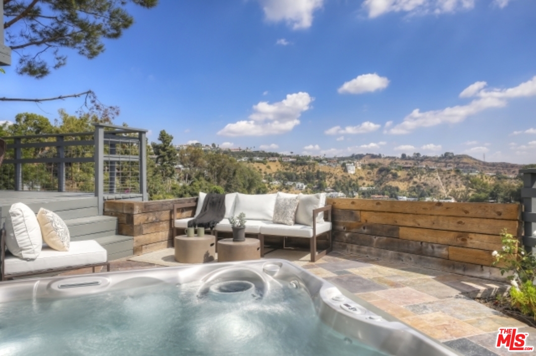 8400 Utica Drive Los Angeles, CA 90046 - Photo 24 of 32 a view of a terrace with couches and sky view