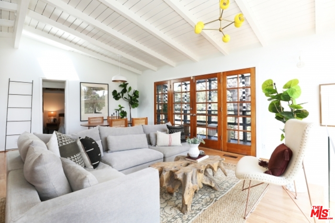 8400 Utica Drive Los Angeles, CA 90046 - Photo 4 of 32 a living room with furniture and a large window