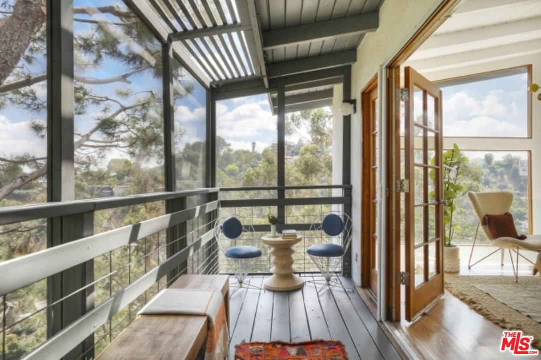 8400 Utica Drive Los Angeles, CA 90046 - Photo 5 of 32 a view of a living room and floor to ceiling window or wooden floor