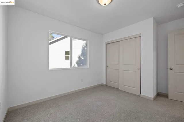 a view of wooden floor and windows in a room