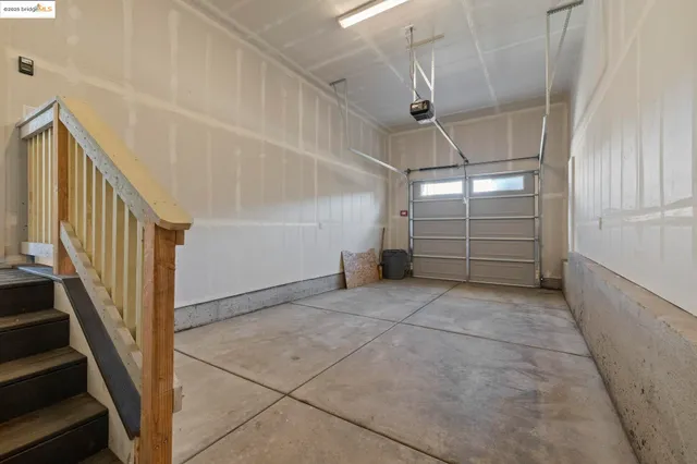a view of a balcony with wooden floor and iron stairs