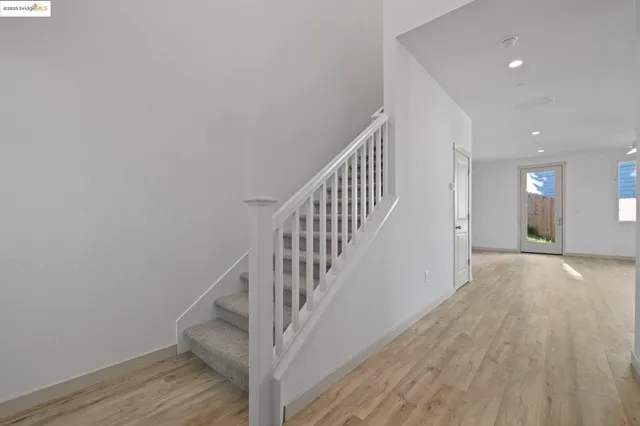 a kitchen with granite countertop a stove and a microwave