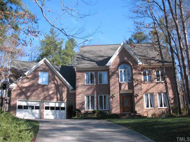 1809 Sarazen Place Raleigh, NC 27615 - Photo 1 of 9 front view of house with a yard