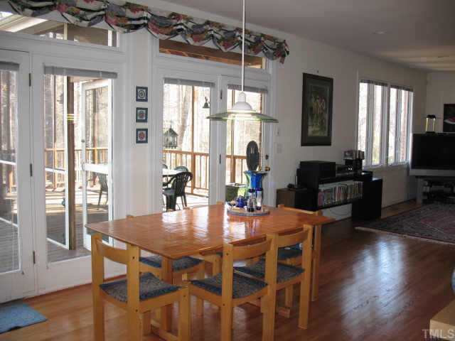 1809 Sarazen Place Raleigh, NC 27615 - Photo 6 of 9 a dining room with furniture window wooden floor