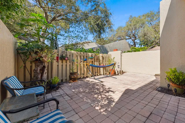 a view of a backyard with a sitting area
