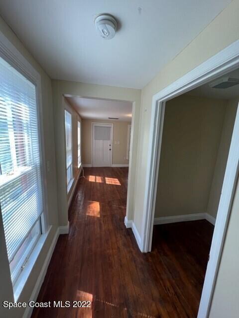 10 Olive Street Cocoa, FL 32922 - Photo 9 of 14 a view of a hallway with wooden floor