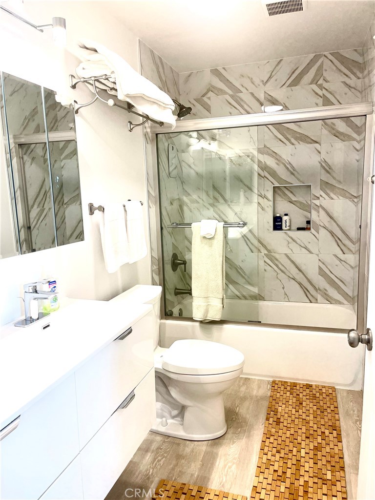 352 Y Place Laguna Beach, CA 92651 - Photo 12 of 22 a bathroom with a sink and a mirror