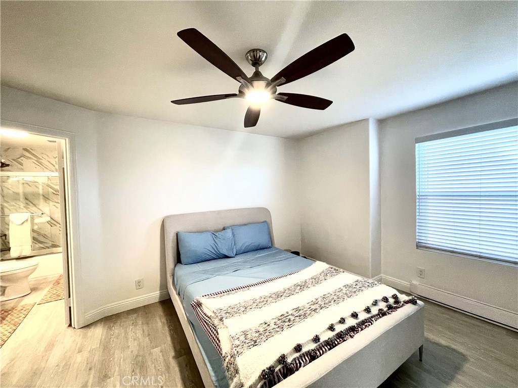 352 Y Place Laguna Beach, CA 92651 - Photo 14 of 22 a bedroom with a bed and a window