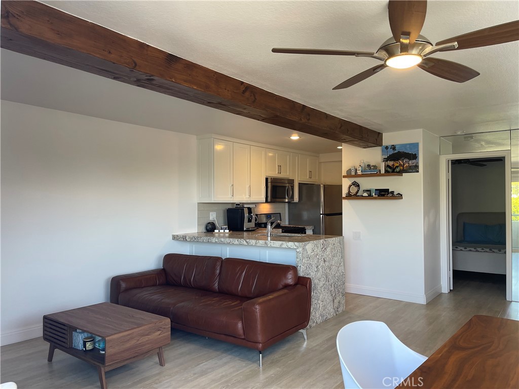 352 Y Place Laguna Beach, CA 92651 - Photo 16 of 22 a living room with furniture and a view of kitchen