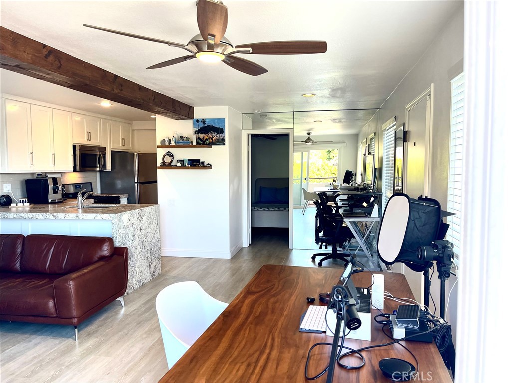 352 Y Place Laguna Beach, CA 92651 - Photo 4 of 22 a living room with furniture a wooden floor and a window
