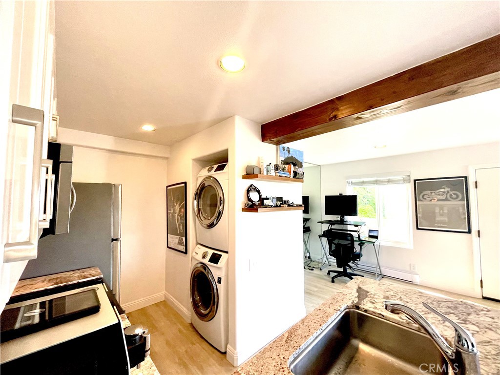 352 Y Place Laguna Beach, CA 92651 - Photo 10 of 22 a view of a kitchen with fridge and workspace
