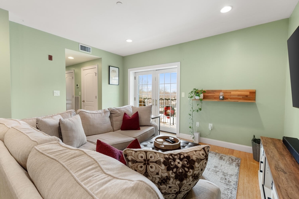 30 High Street, Unit 31 Medford, MA 02155 - Photo 11 of 27 a living room with furniture and a couch