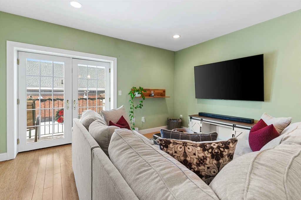 30 High Street, Unit 31 Medford, MA 02155 - Photo 12 of 27 a living room with furniture and a flat screen tv