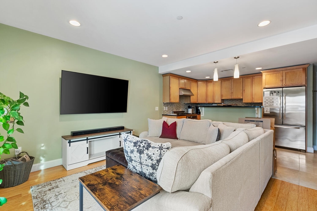 30 High Street, Unit 31 Medford, MA 02155 - Photo 13 of 27 a living room with furniture and a flat screen tv