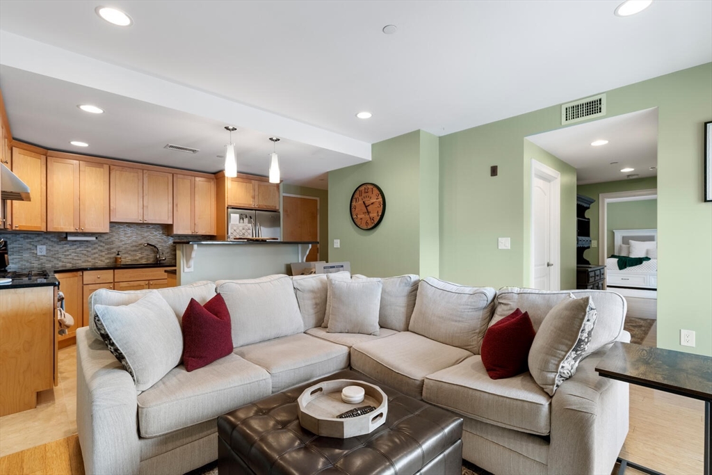 30 High Street, Unit 31 Medford, MA 02155 - Photo 14 of 27 a living room with furniture and kitchen view