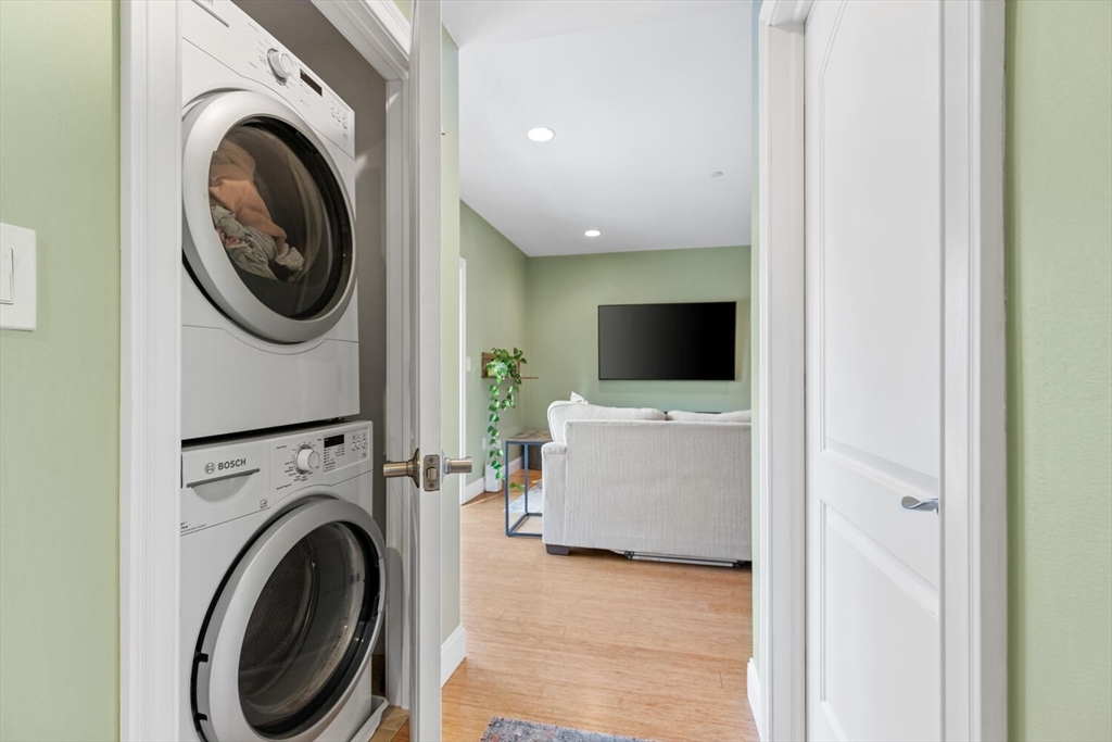 30 High Street, Unit 31 Medford, MA 02155 - Photo 17 of 27 a view of a hallway with washer and dryer