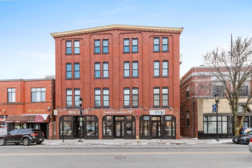 30 High Street, Unit 31 Medford, MA 02155 - Photo 2 of 27 front view of a brick building