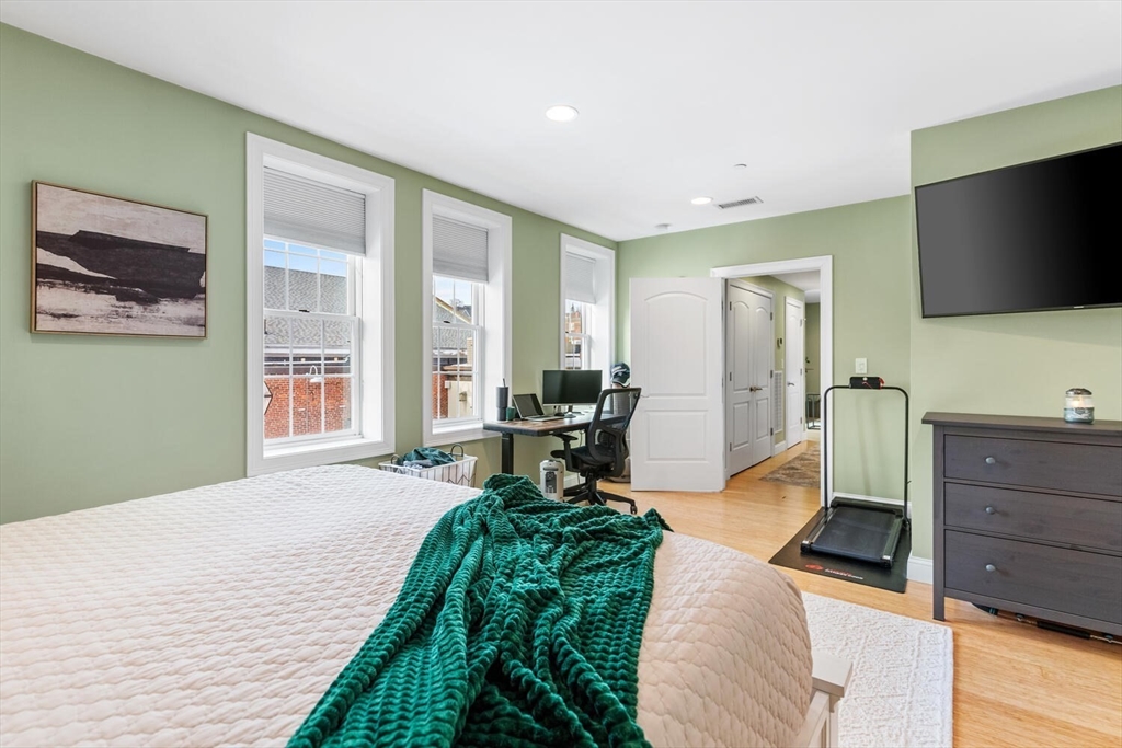 30 High Street, Unit 31 Medford, MA 02155 - Photo 23 of 27 a bedroom with a bed and furniture