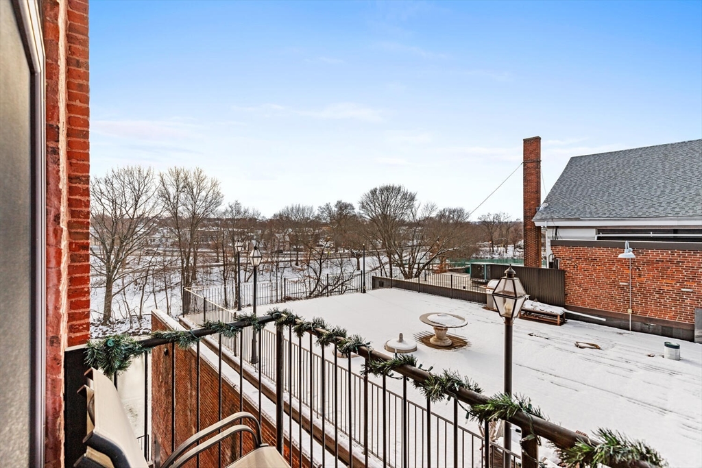 30 High Street, Unit 31 Medford, MA 02155 - Photo 25 of 27 a view of a balcony with couches