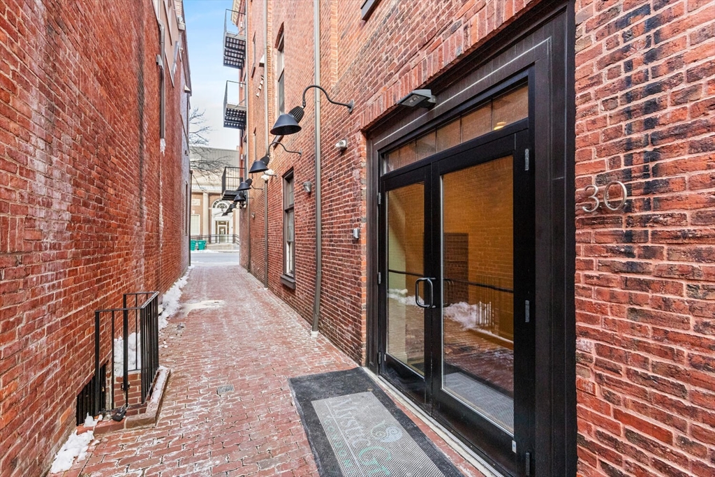 30 High Street, Unit 31 Medford, MA 02155 - Photo 3 of 27 a view of a brick wall from a windows