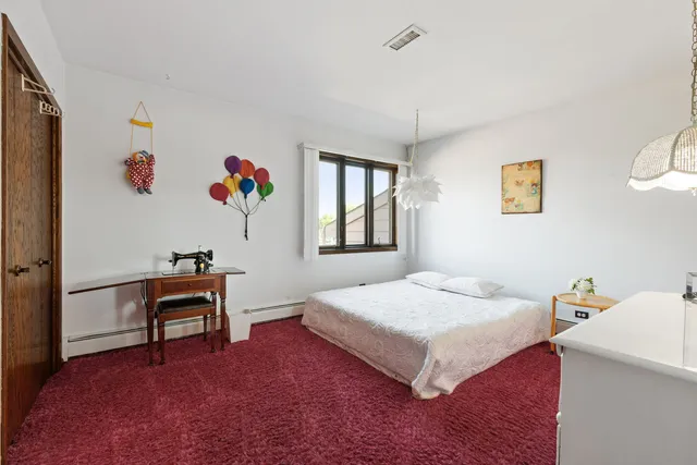 a bedroom with a bed and a table