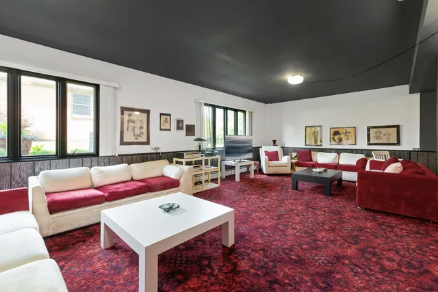 a living room with furniture and a table