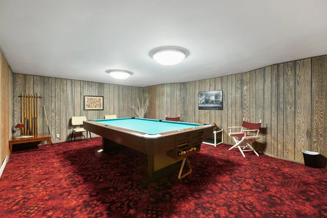 a bathroom with a double vanity sink and a window