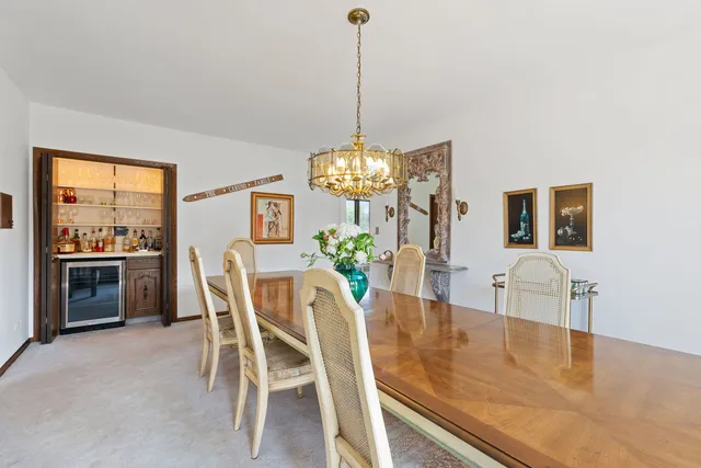 a dining room with furniture and window