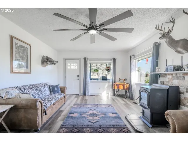 a living room with furniture and a dining table