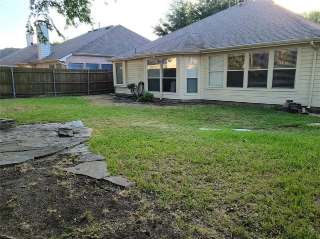 a view of a yard in front of a house