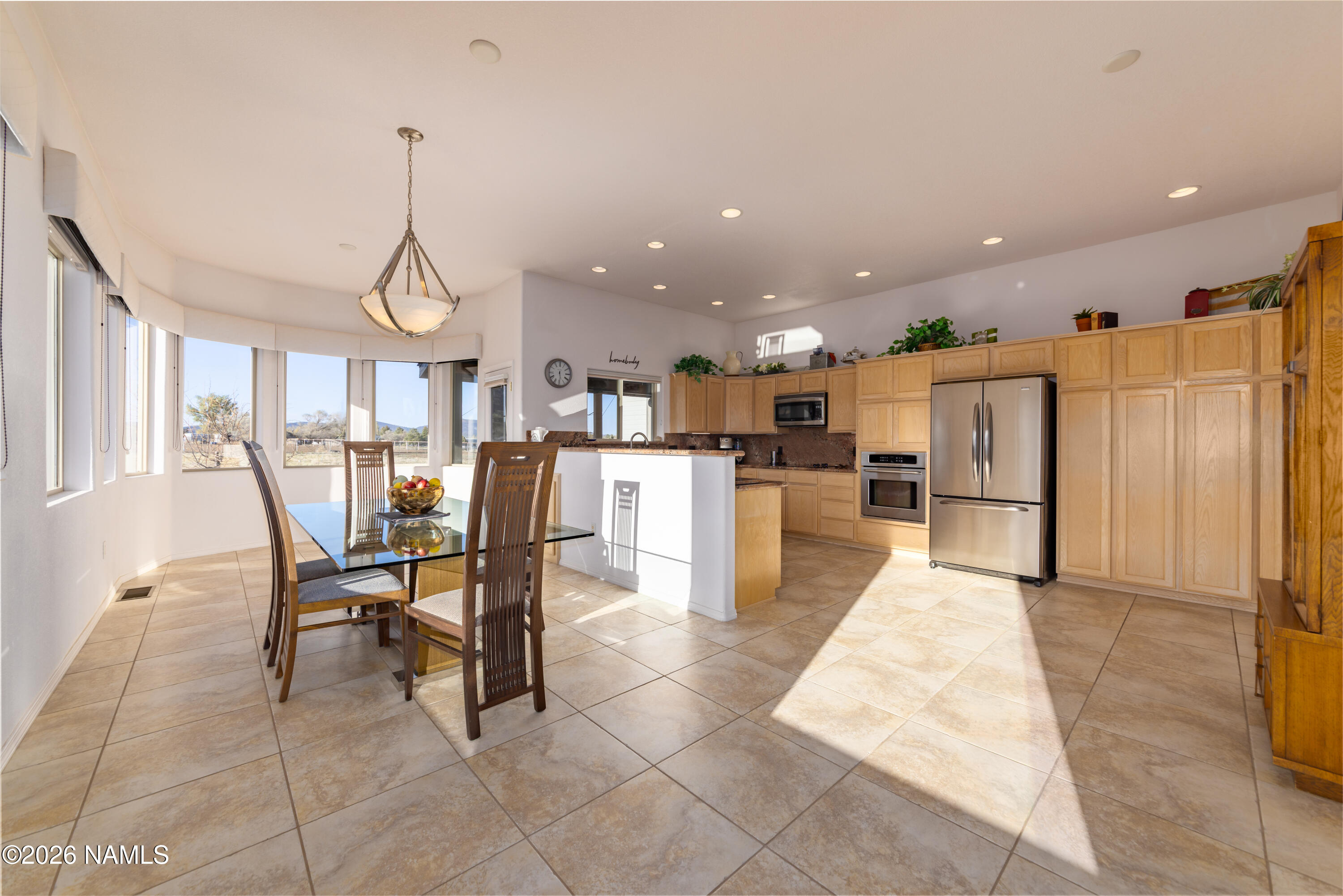 6875 Will O' Pete Road Flagstaff, AZ 86004 - Photo 15 of 43 a view of a kitchen with dining space and windows
