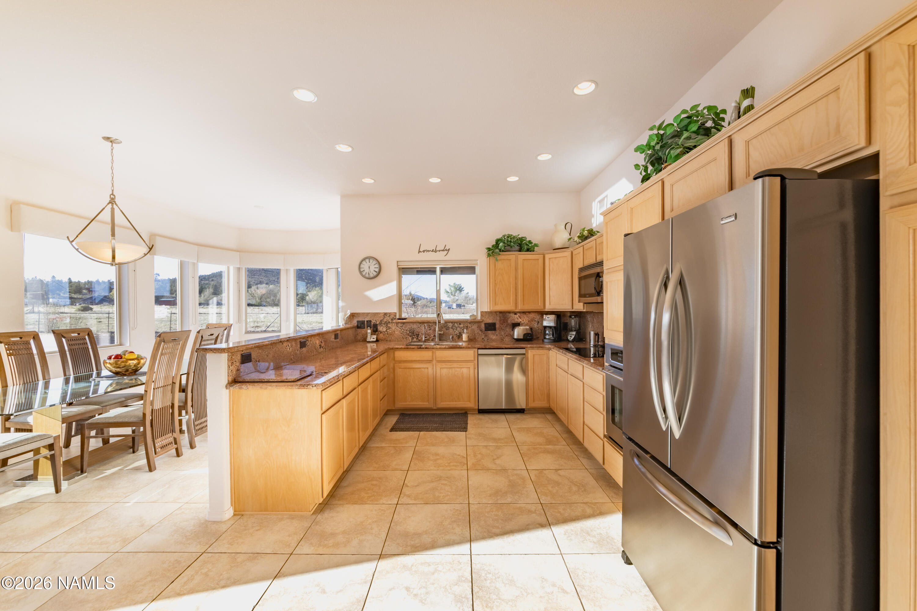 6875 Will O' Pete Road Flagstaff, AZ 86004 - Photo 16 of 43 a large white kitchen with lots of appliances