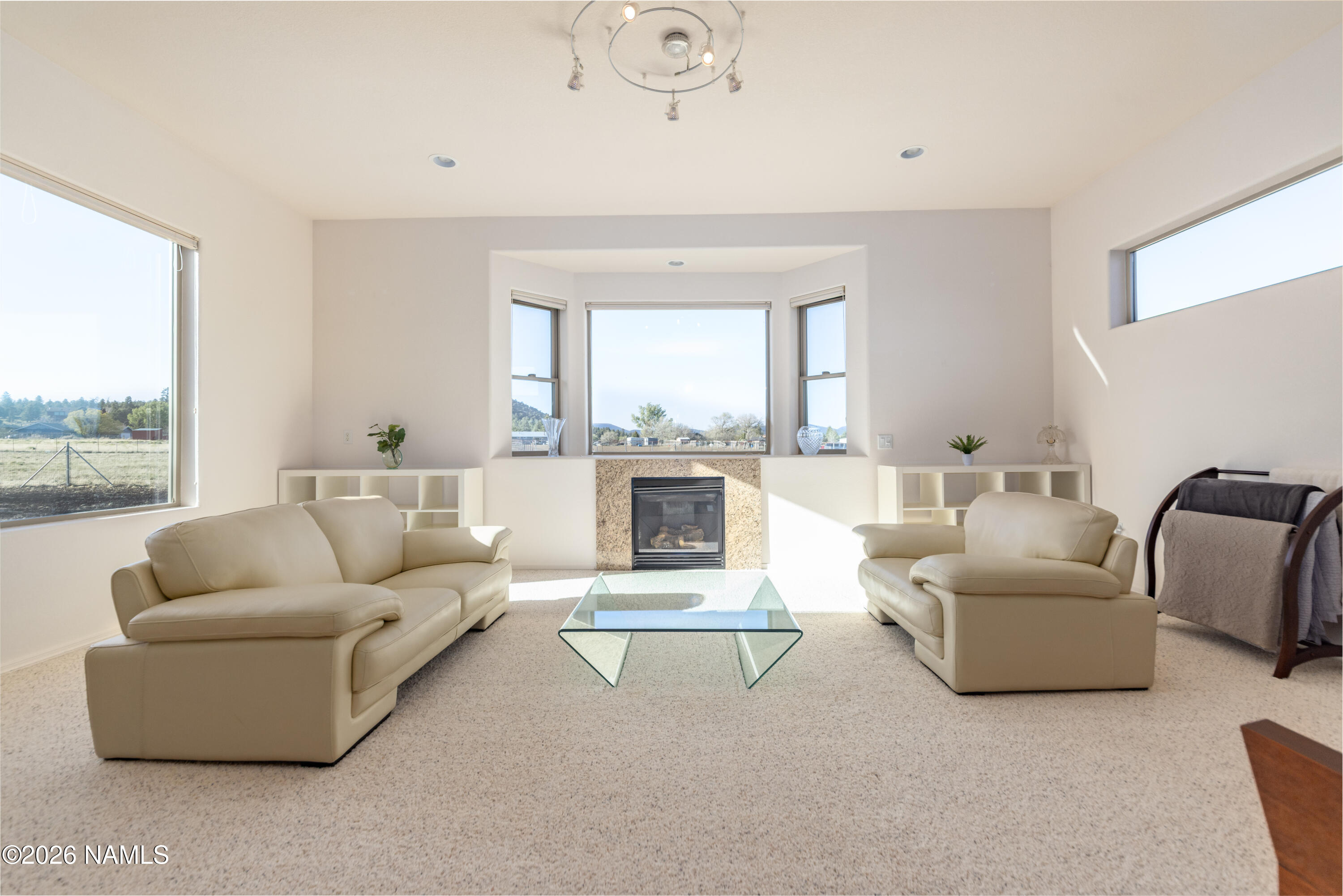 6875 Will O' Pete Road Flagstaff, AZ 86004 - Photo 24 of 43 a living room with furniture and a large window