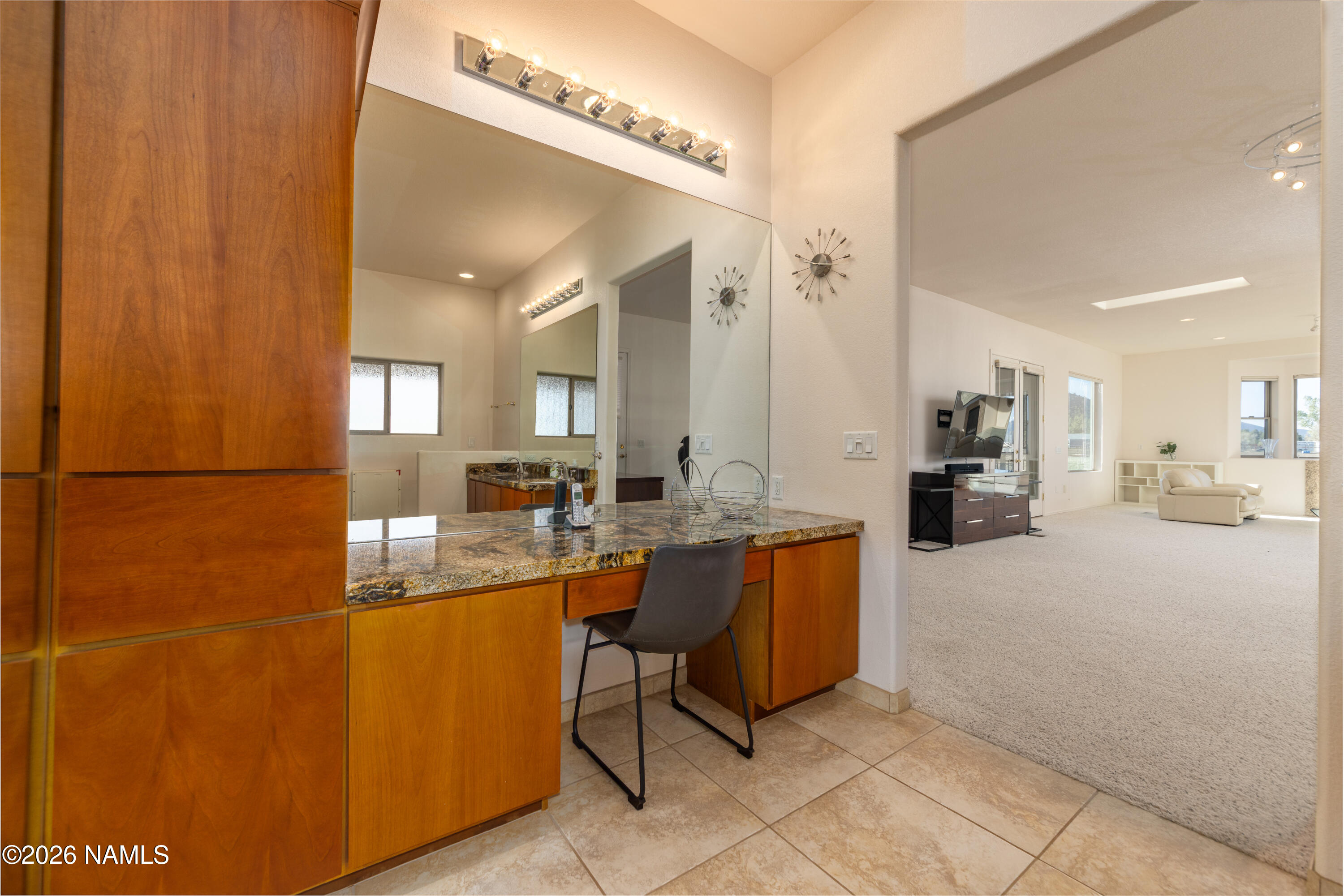 6875 Will O' Pete Road Flagstaff, AZ 86004 - Photo 28 of 43 a large living room with stainless steel appliances kitchen island granite countertop a table and chairs in it