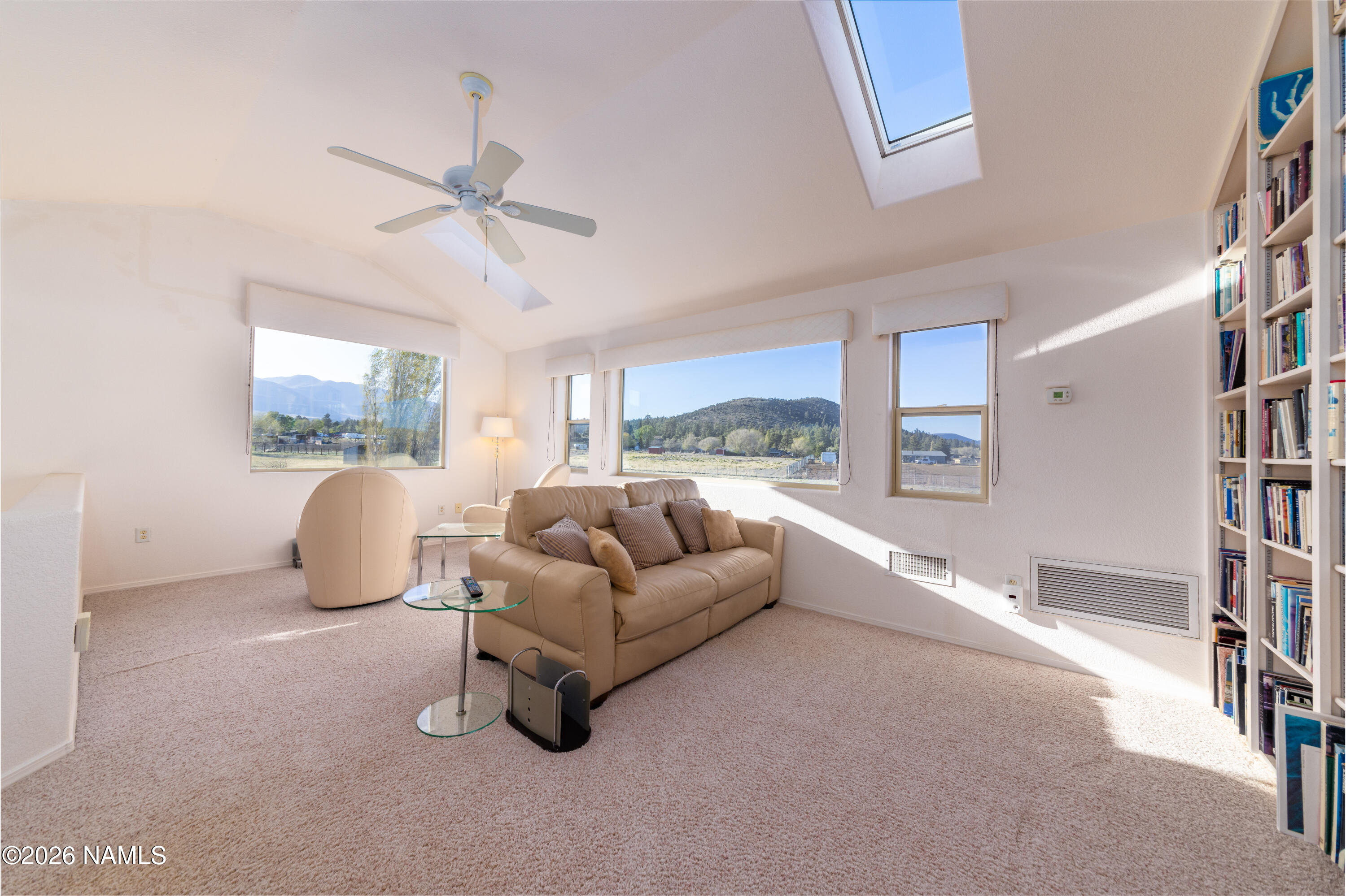 6875 Will O' Pete Road Flagstaff, AZ 86004 - Photo 30 of 43 a living room with furniture and a large window