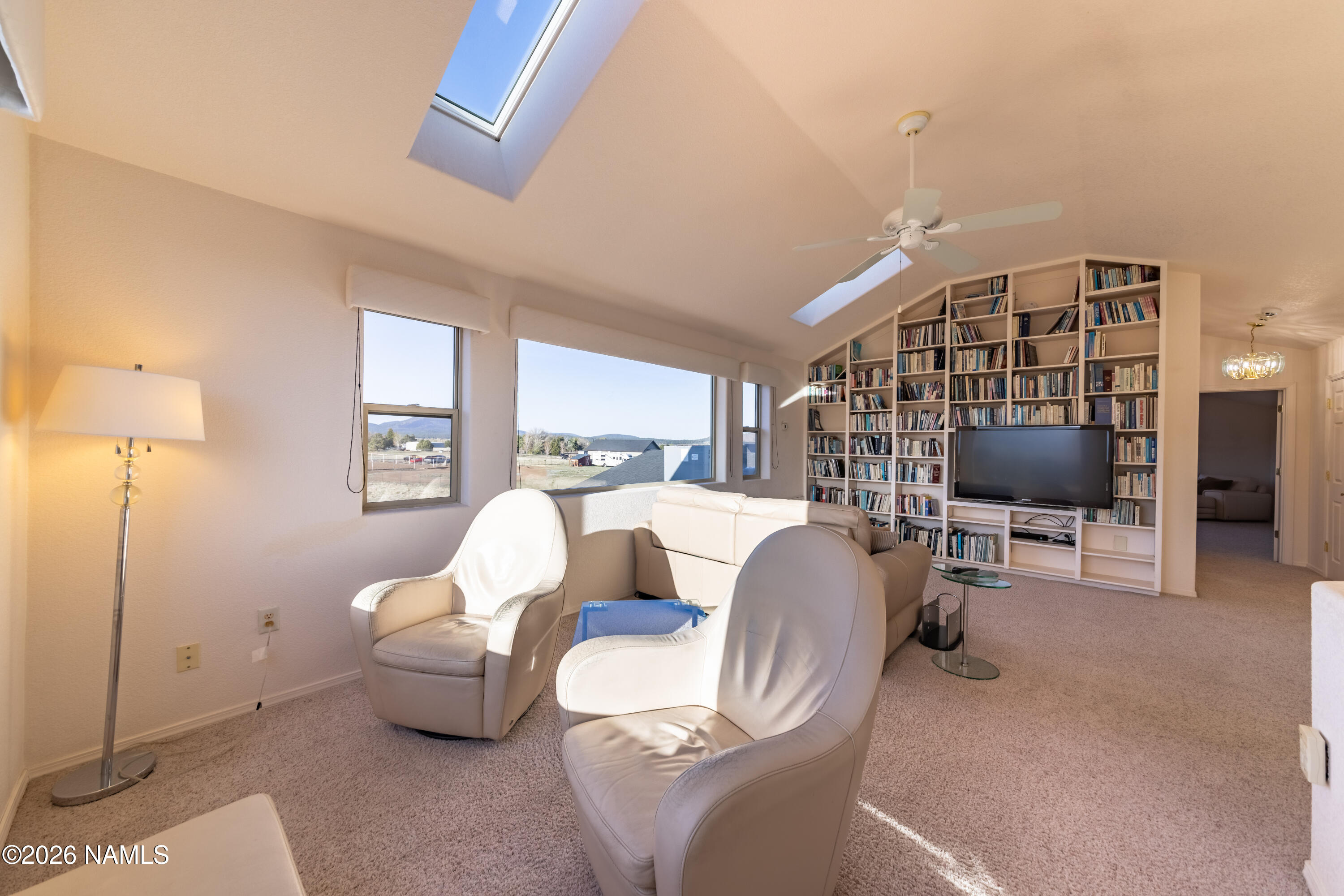 6875 Will O' Pete Road Flagstaff, AZ 86004 - Photo 32 of 43 a living room with furniture and a window