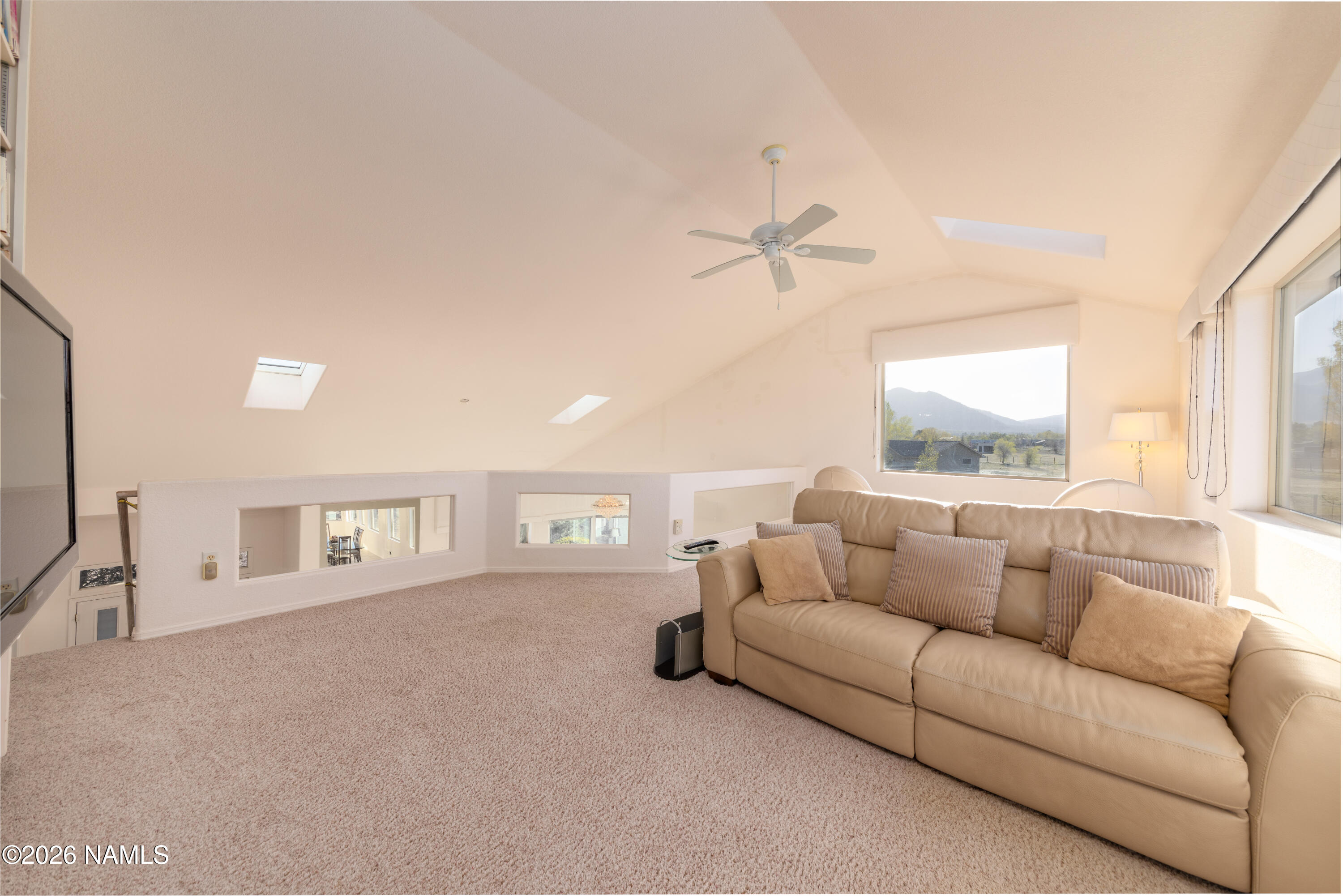 6875 Will O' Pete Road Flagstaff, AZ 86004 - Photo 33 of 43 a living room with furniture and a window