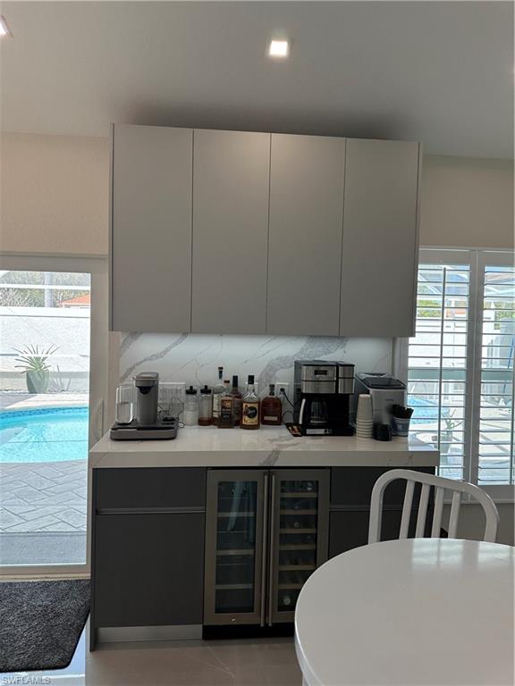 1595 Whispering Oaks Circle Naples, FL 34110 - Photo 6 of 15 a kitchen with a cabinets and white appliances