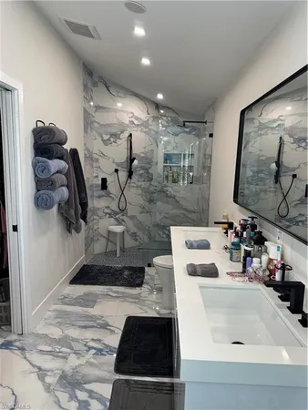 a bathroom with a sink and mirror