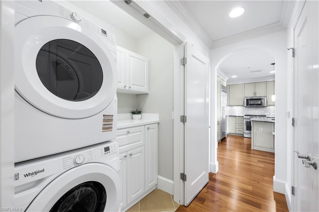 9123 Strada Place, Unit 7309 Naples, FL 34108 - Photo 16 of 48 Laundry area w/ built-in cabinet space, and New washing machine and dryer