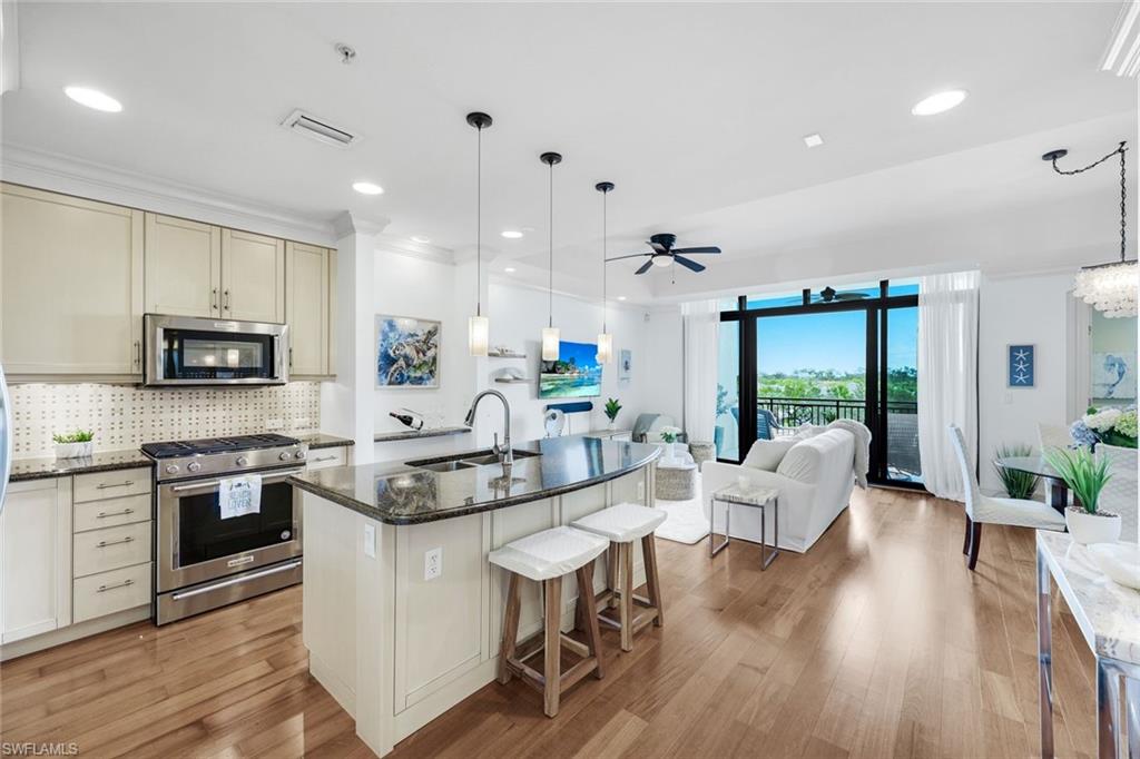 9123 Strada Place, Unit 7309 Naples, FL 34108 - Photo 45 of 46 a large kitchen with granite countertop lots of counter top space