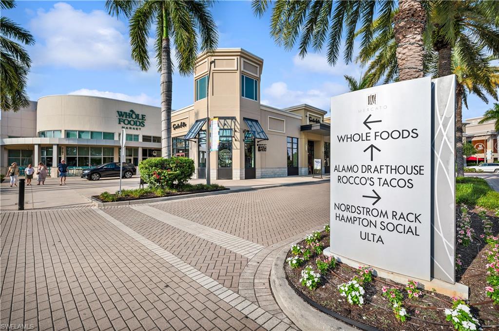 9123 Strada Place, Unit 7309 Naples, FL 34108 - Photo 40 of 46 a sign on the side of a building
