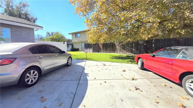 a view of a car parked in front of a house