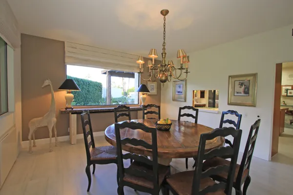 a view of a dining room with furniture window and outside view